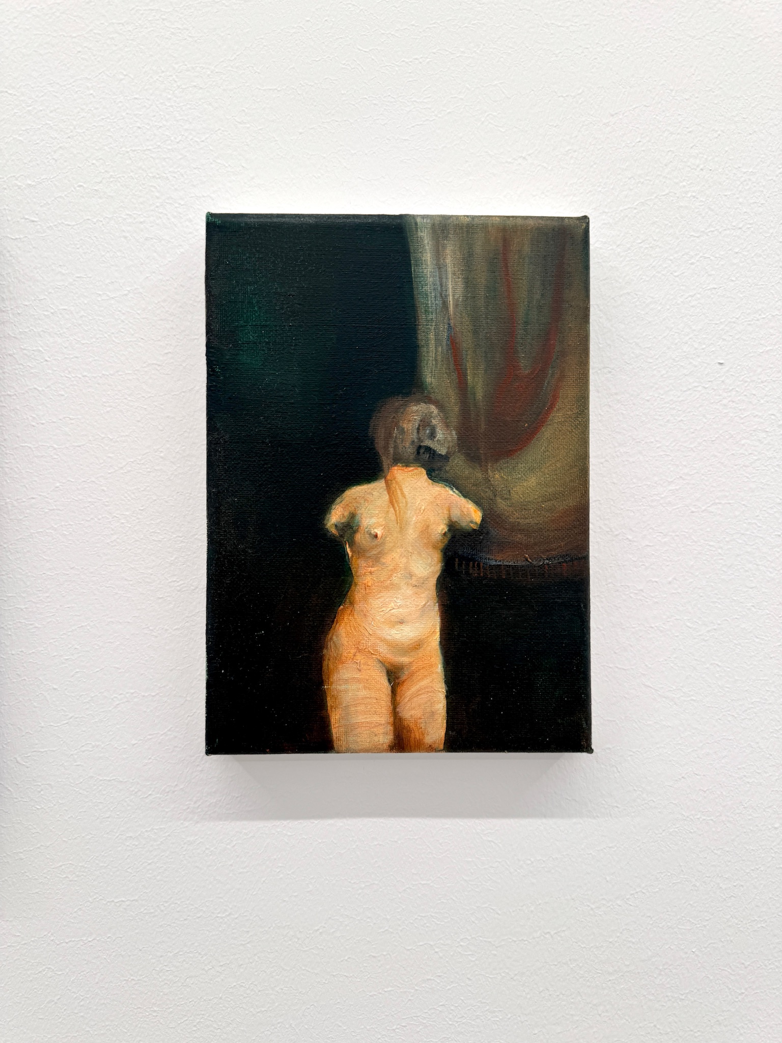 Installation view of Emeli Theander’s painting Falling displayed on a white gallery wall.